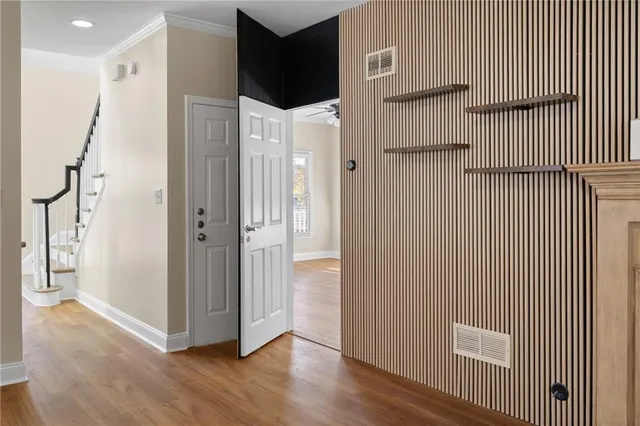 a bathroom with a granite countertop sink a large mirror and a bathtub next to a window