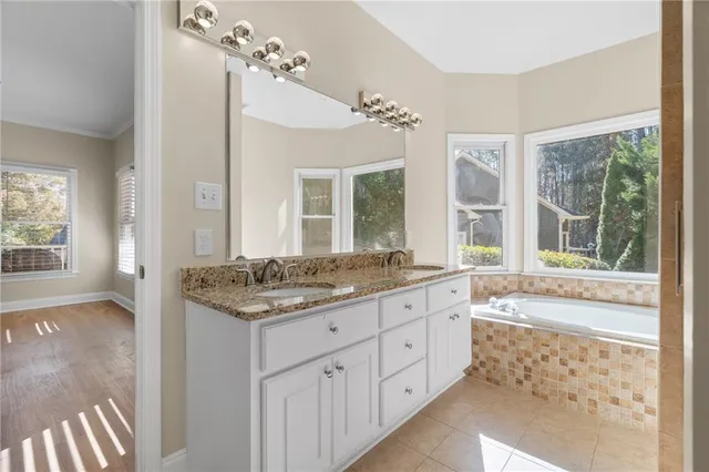 a view of an empty room with glass door and balcony