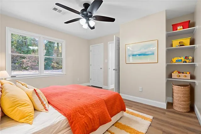 a bathroom with a granite countertop sink mirror and vanity