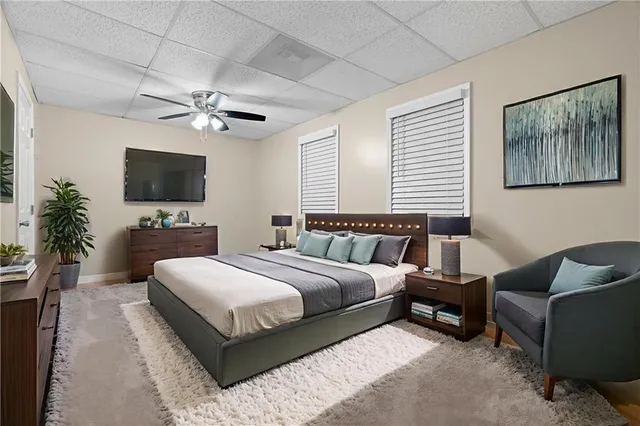 a bathroom with a sink a mirror and shower