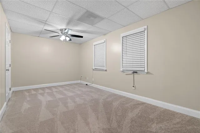 a backyard of a house with a tree