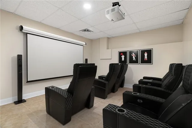 an aerial view of a house with a yard and lake view