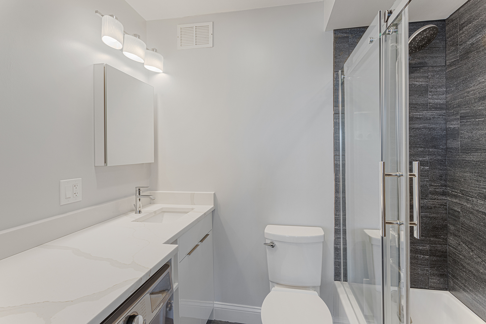 6166 North Sheridan Road, Unit 24L Chicago, IL 60660 - Photo 10 of 18 a bathroom with a sink a toilet and shower