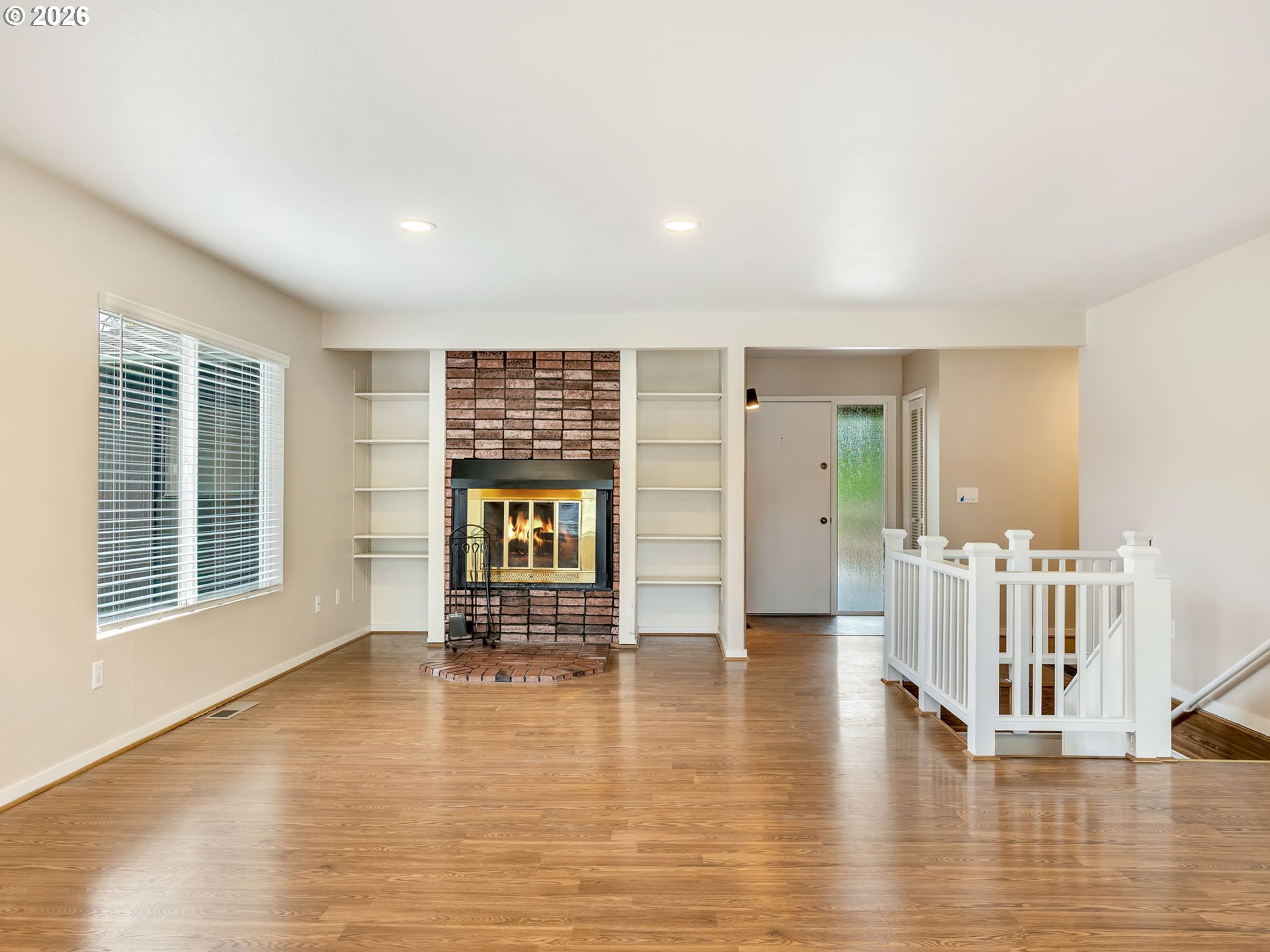 91923 Ridge Road Warrenton, OR 97146 - Photo 5 of 35 a view of an empty room with a window and wooden floor