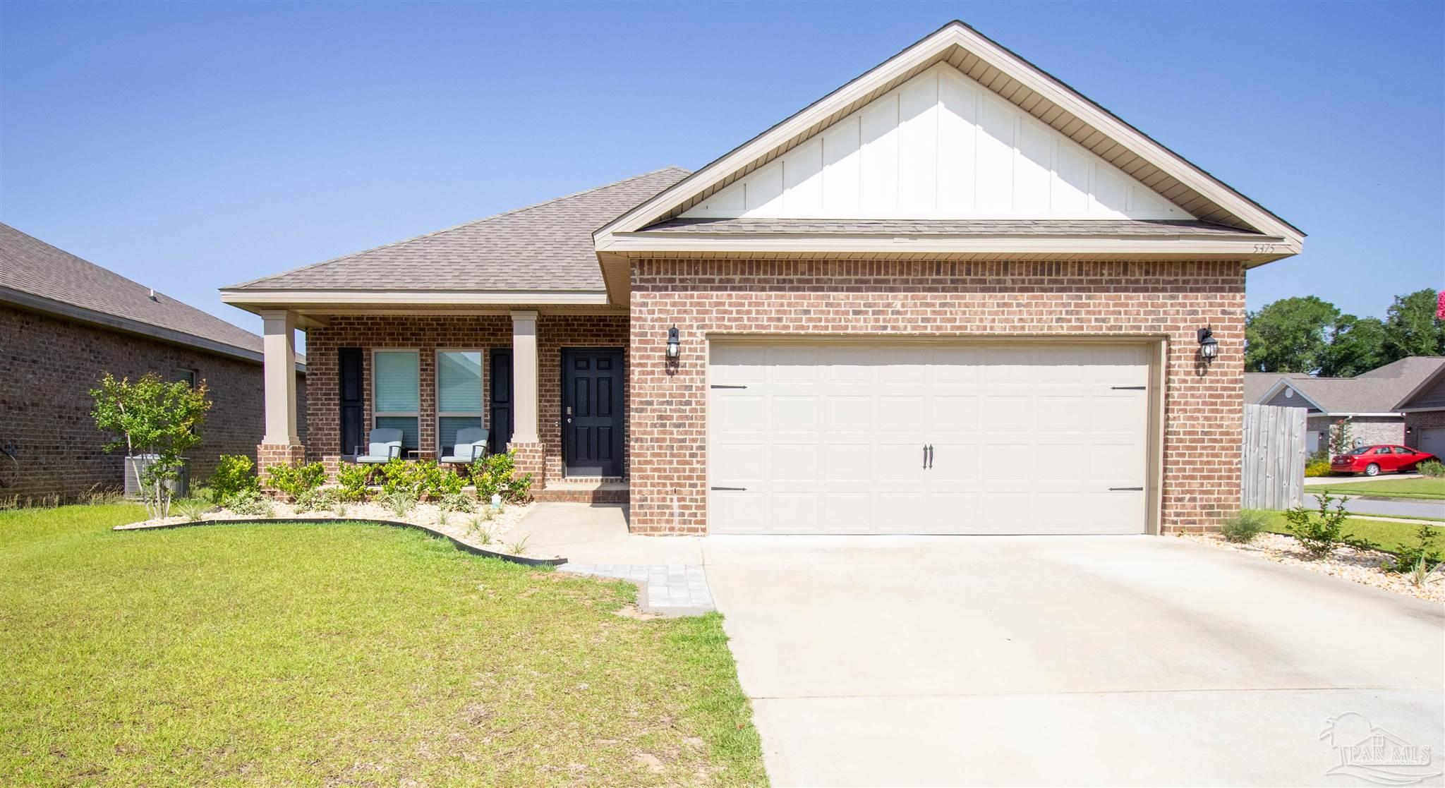 5375 Red Shoulder Road Milton, FL 32571 - Photo 1 of 38 a front view of a house with a yard