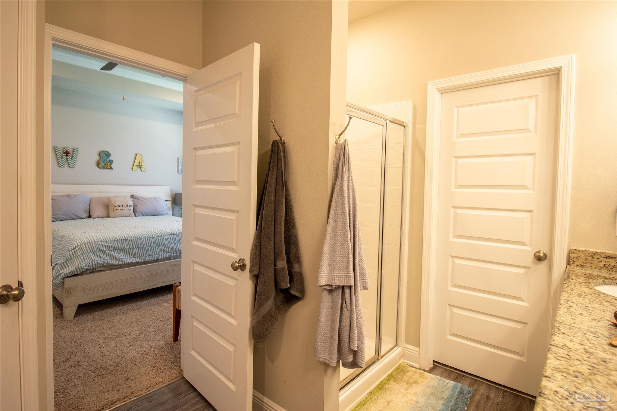 5375 Red Shoulder Road Milton, FL 32571 - Photo 18 of 38 a bedroom with a bed and a window