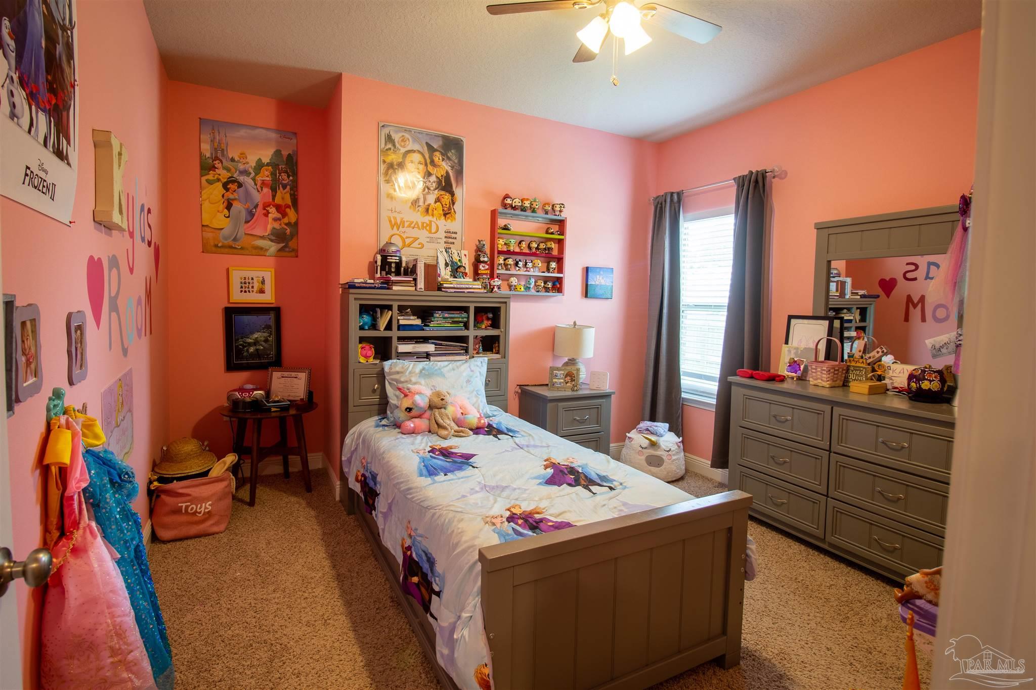 5375 Red Shoulder Road Milton, FL 32571 - Photo 20 of 38 a bed room with a bed and a furniture