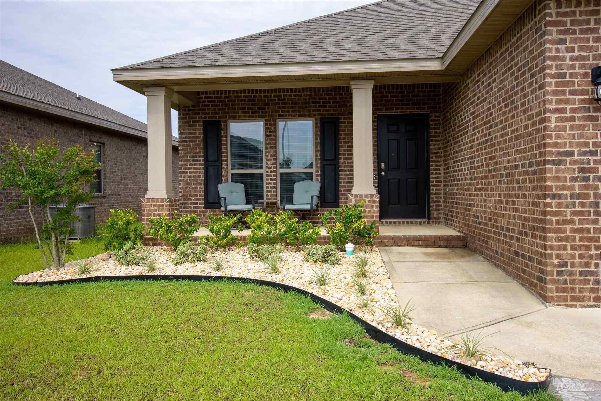 5375 Red Shoulder Road Milton, FL 32571 - Photo 2 of 38 a view of a house with a yard patio and swimming pool