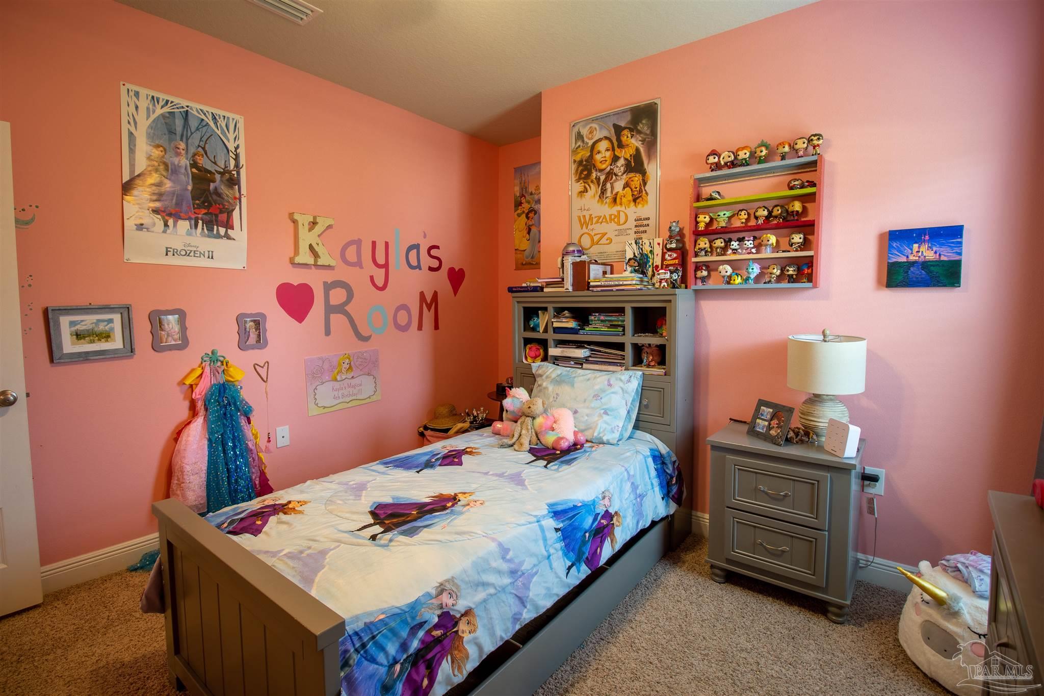 5375 Red Shoulder Road Milton, FL 32571 - Photo 21 of 38 a bedroom that has a bed and a table in it