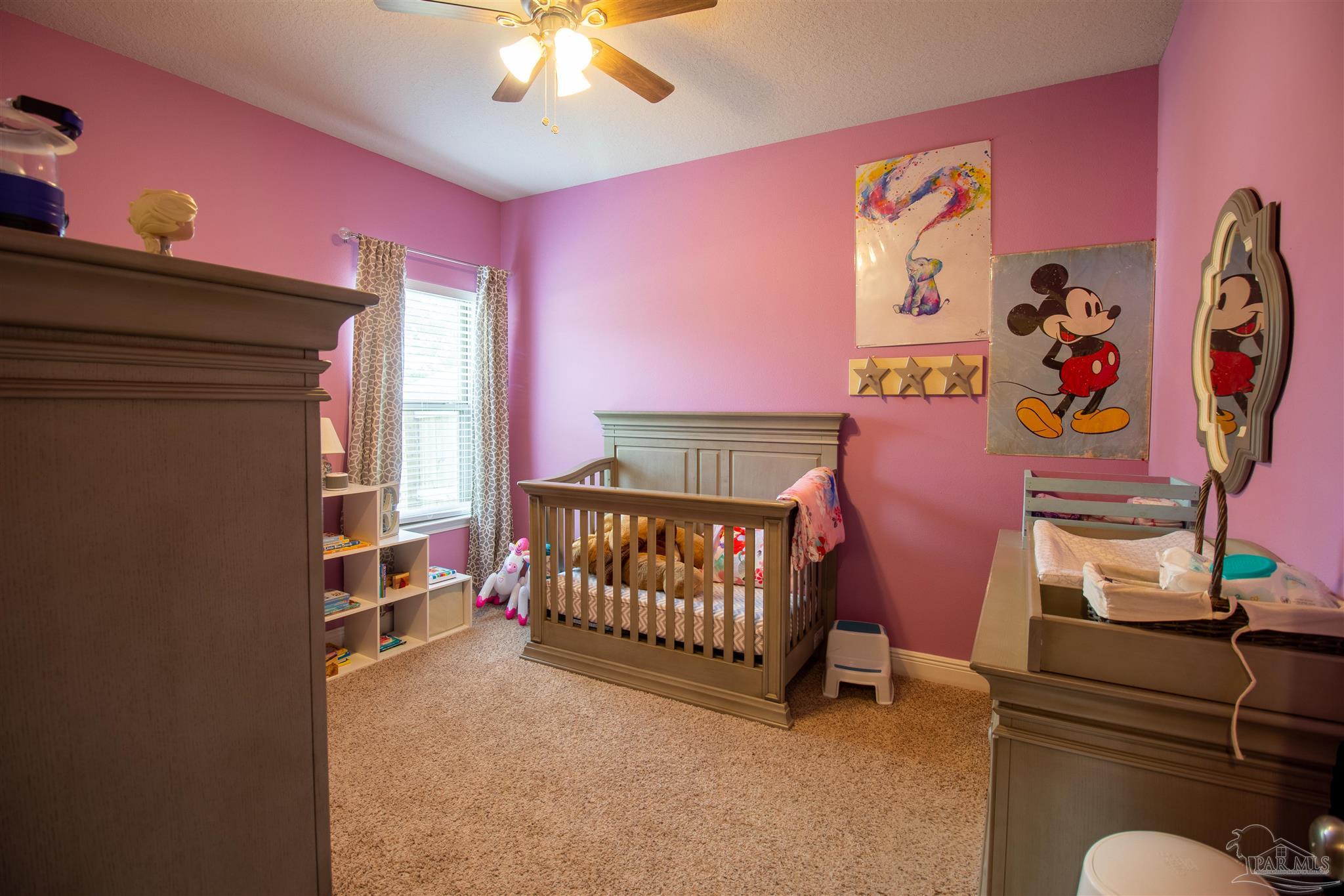 5375 Red Shoulder Road Milton, FL 32571 - Photo 25 of 38 a bedroom with furniture and a window