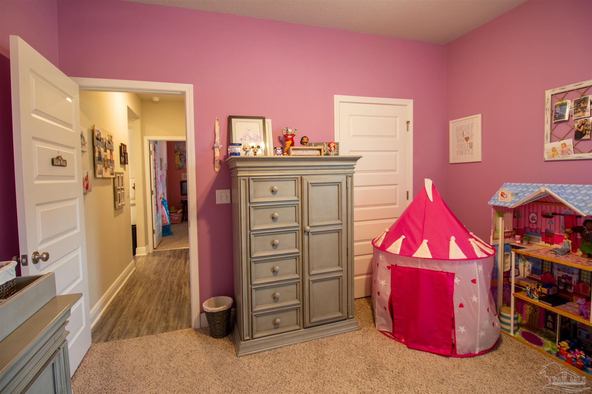 5375 Red Shoulder Road Milton, FL 32571 - Photo 27 of 38 a view of a bedroom with a baby crib