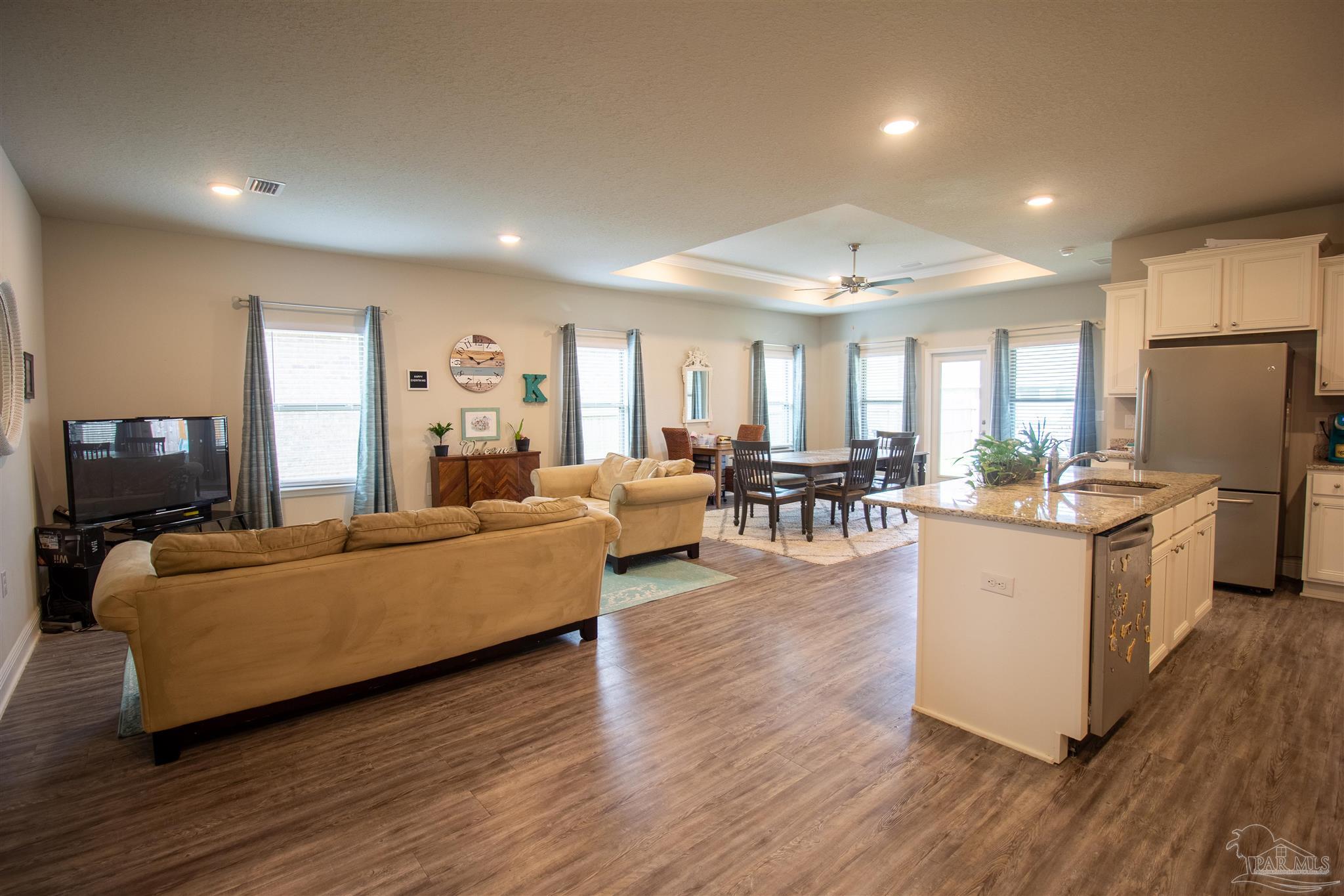 5375 Red Shoulder Road Milton, FL 32571 - Photo 6 of 38 a living room with furniture and a flat screen tv
