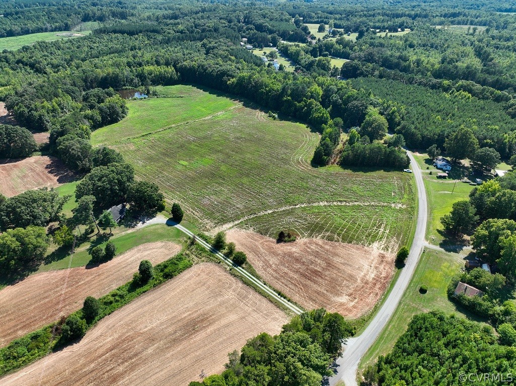 Birds eye view of property with a rural view