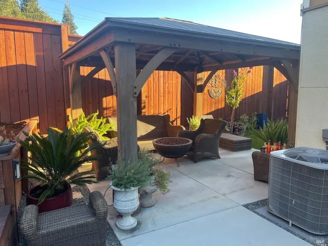 a view of swimming pool with outdoor seating and plants