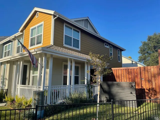 a front view of a house with a yard