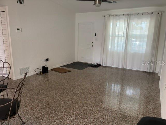 11601 109th Street Seminole, FL 33778 - Photo 2 of 29 a bedroom with a bed and a mirror