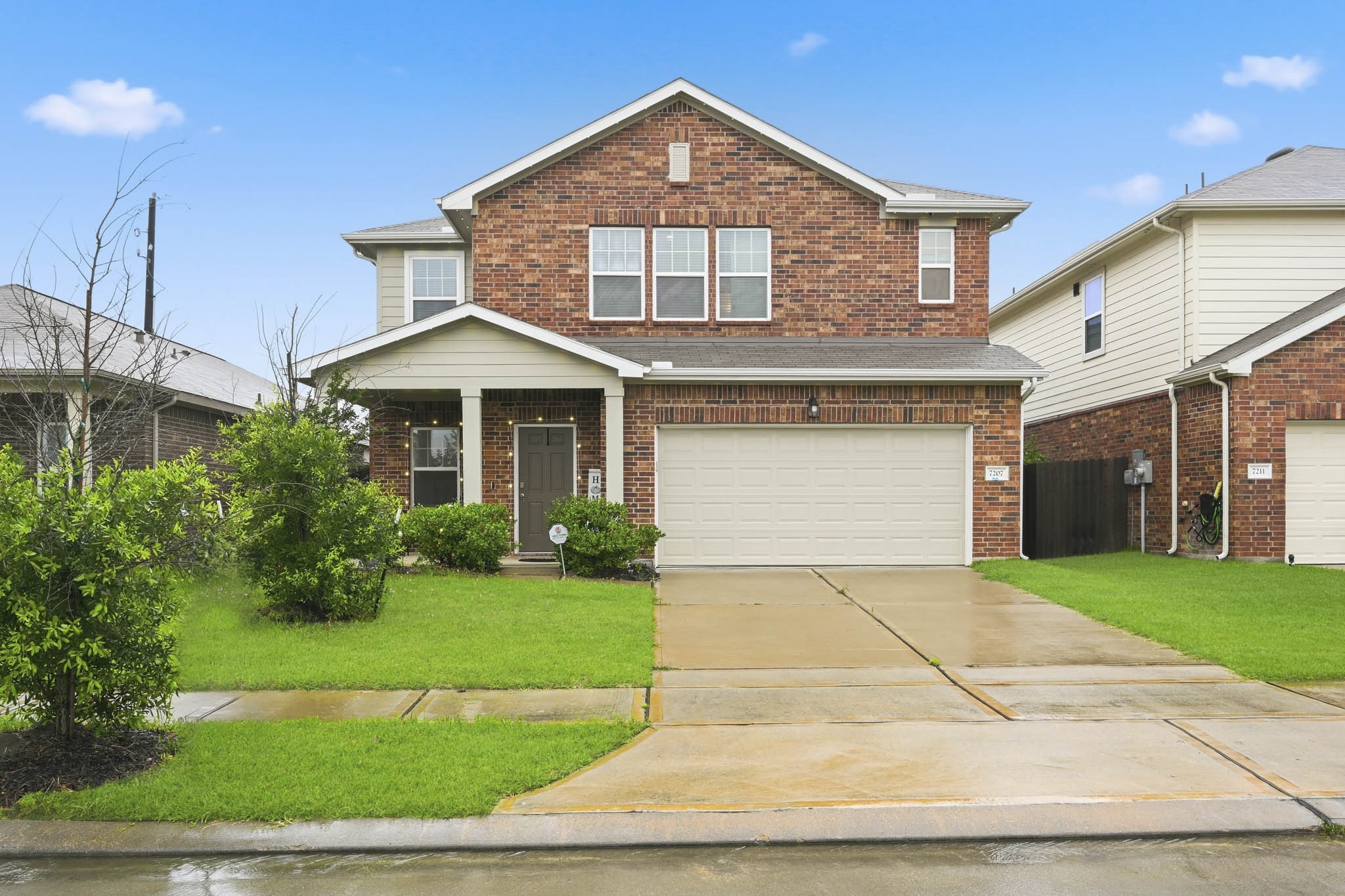 7207 Evitale Way Houston, TX 77049 - Photo 1 of 43 a front view of a house with a yard and garage