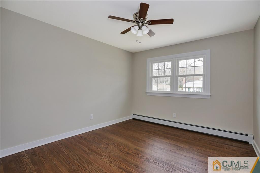 1103 Sawmill Road Mountainside, NJ 07092 - Photo 21 of 25 wooden floor in an empty room with a window
