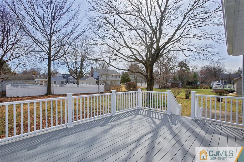 1103 Sawmill Road Mountainside, NJ 07092 - Photo 22 of 25 a view of a deck with mountain view and wooden fence