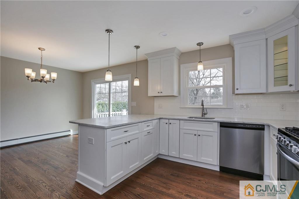 1103 Sawmill Road Mountainside, NJ 07092 - Photo 6 of 25 a kitchen with a sink cabinets and window