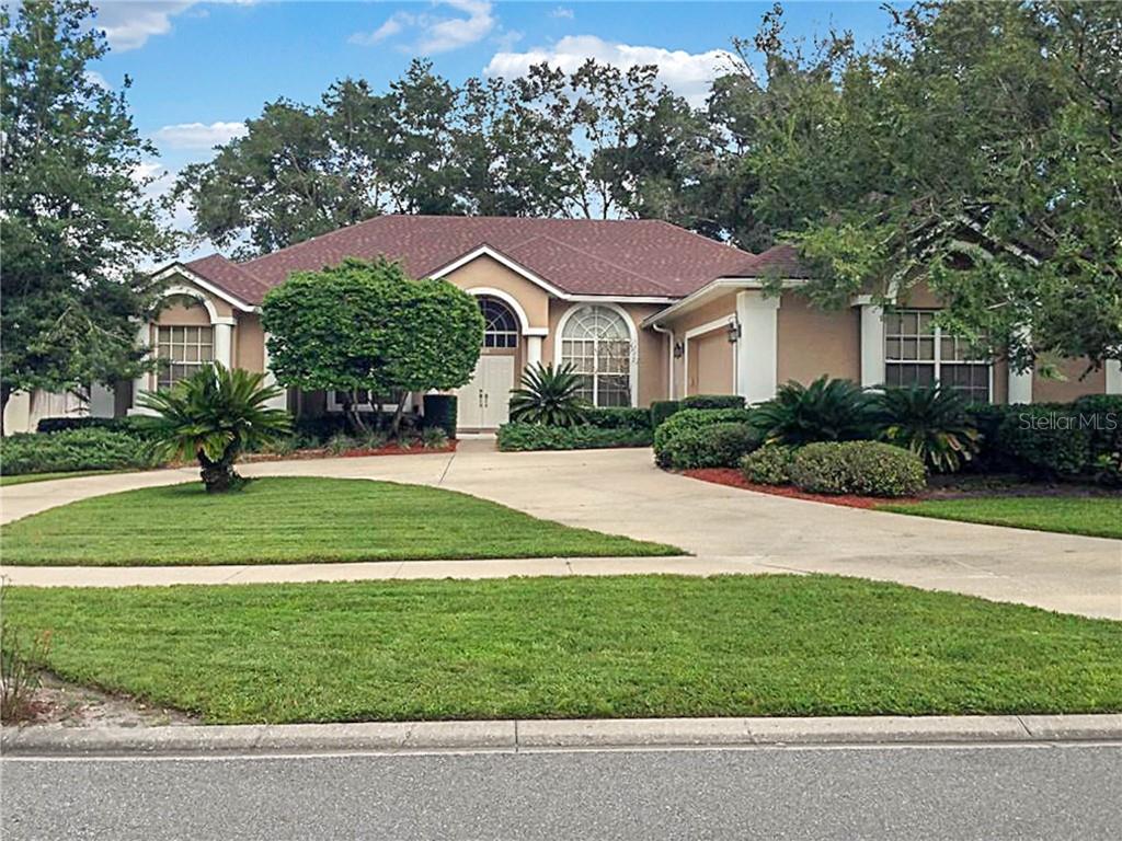 913 Ridge Spring Court Apopka, FL 32712 - Photo 1 of 1 a front view of a house with a yard