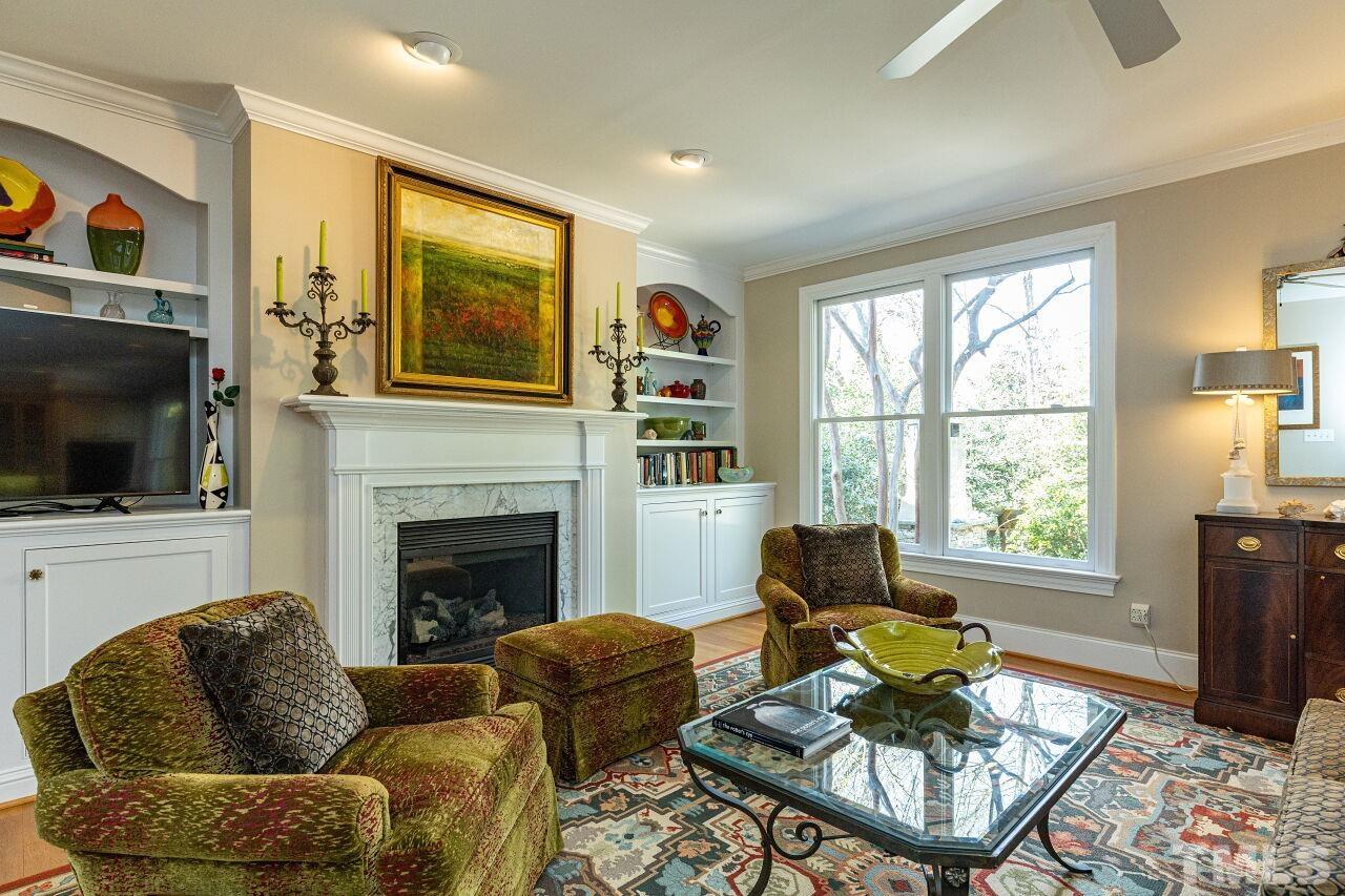 1124 Hobson Court Raleigh, NC 27607 - Photo 11 of 36 a living room with furniture fireplace and window