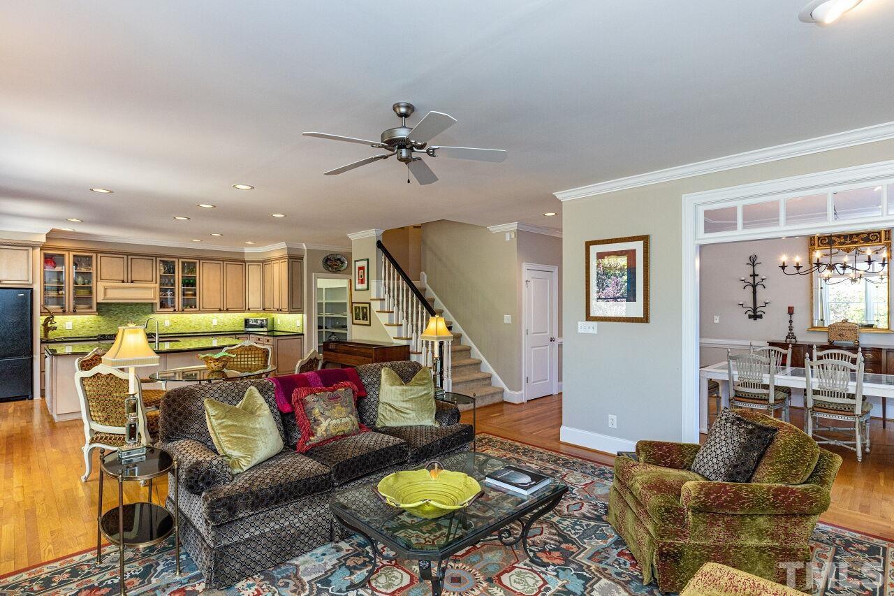 1124 Hobson Court Raleigh, NC 27607 - Photo 14 of 36 a living room with furniture and a dining table with wooden floor