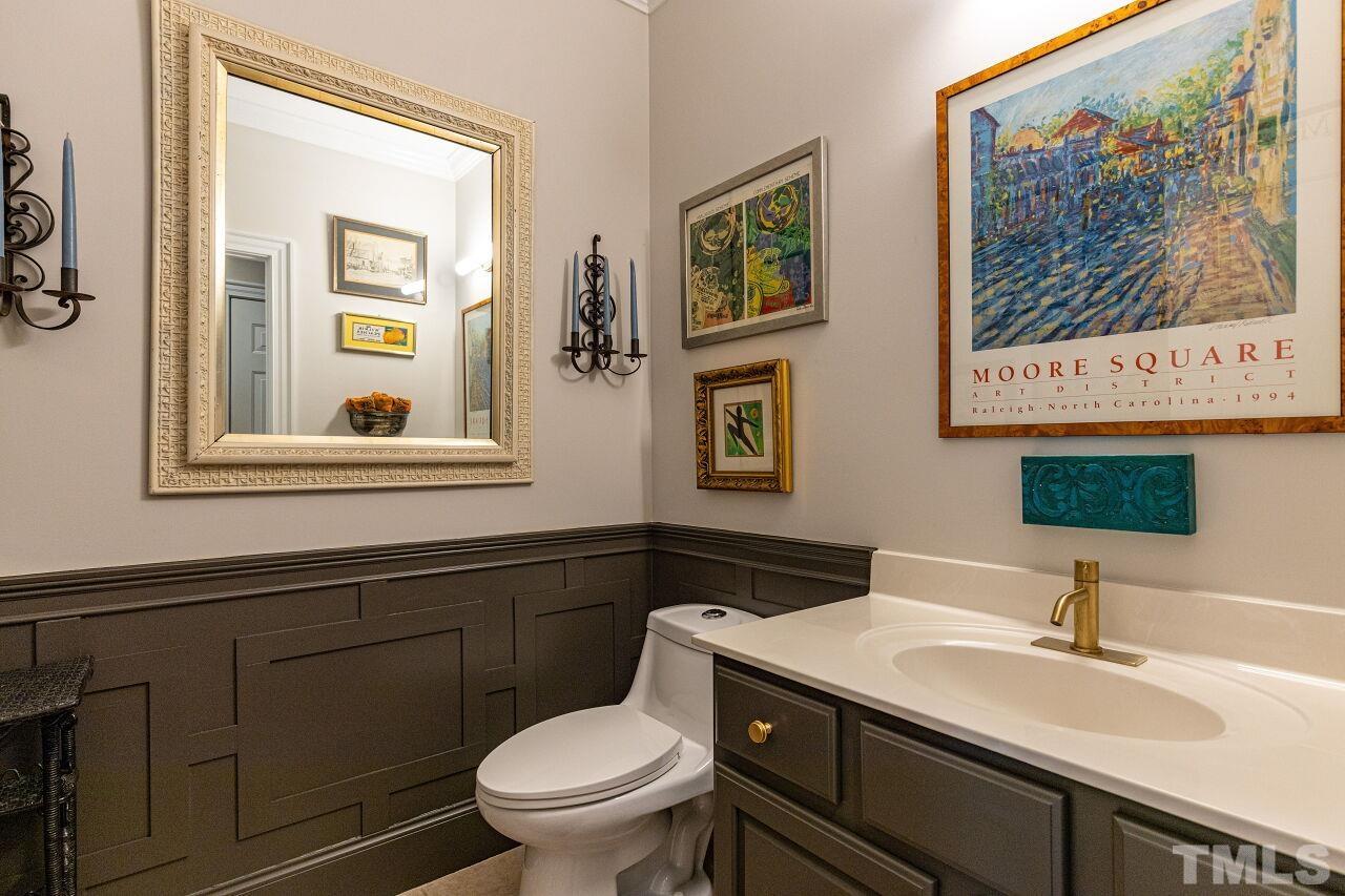 1124 Hobson Court Raleigh, NC 27607 - Photo 20 of 36 a bathroom with a toilet a sink and mirror