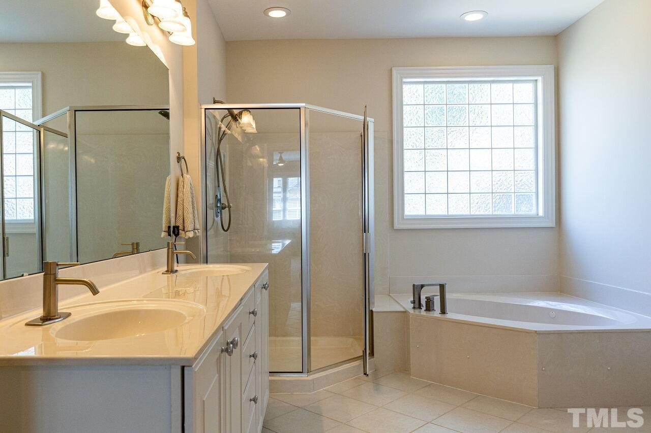 1124 Hobson Court Raleigh, NC 27607 - Photo 23 of 36 a bathroom with a bathtub and a sink