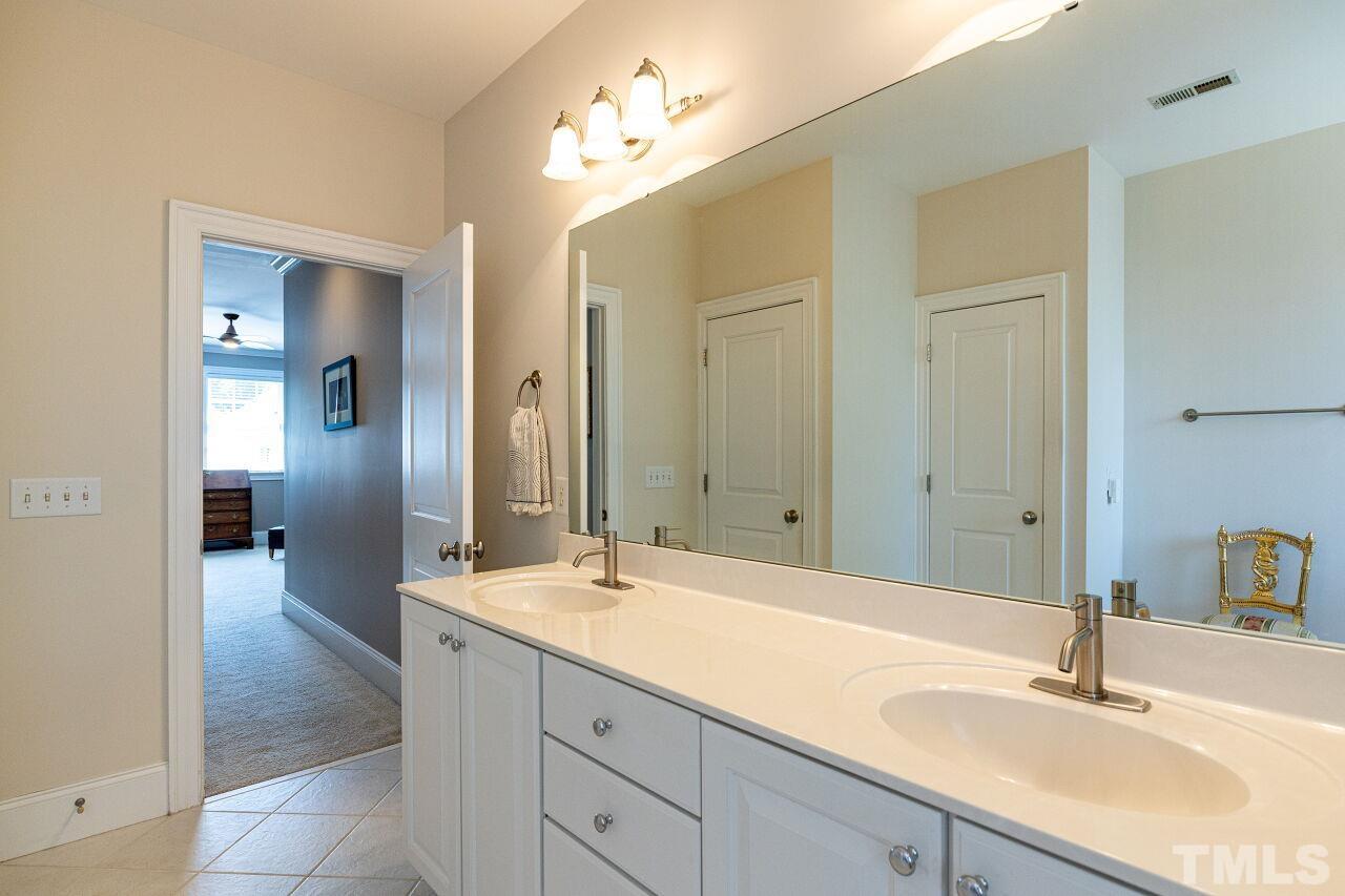 1124 Hobson Court Raleigh, NC 27607 - Photo 24 of 36 a bathroom with a sink and a mirror