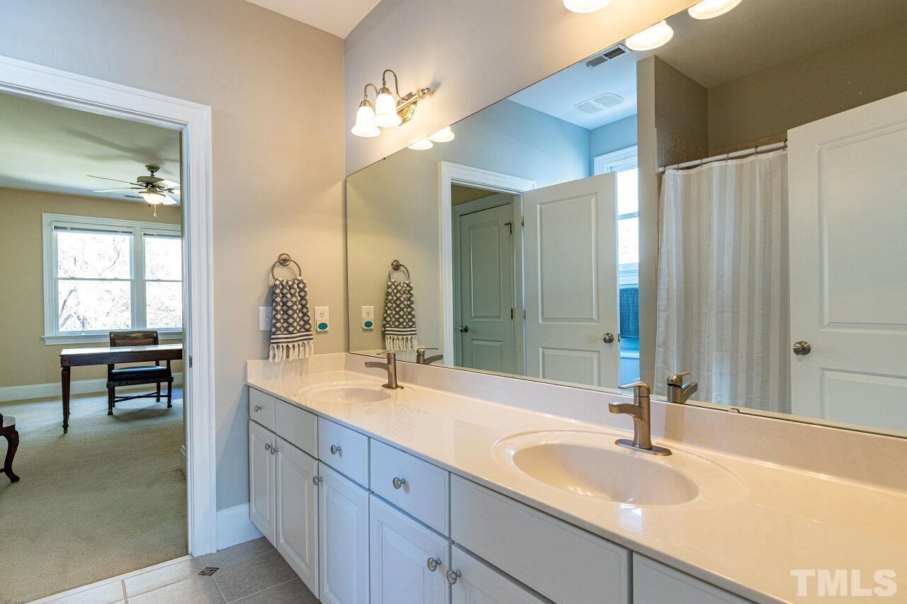 1124 Hobson Court Raleigh, NC 27607 - Photo 27 of 36 a bathroom with a sink and a mirror