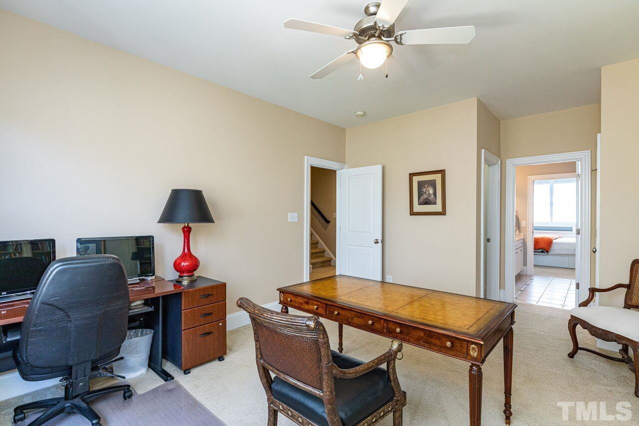 1124 Hobson Court Raleigh, NC 27607 - Photo 29 of 36 a room with furniture and a chandelier fan