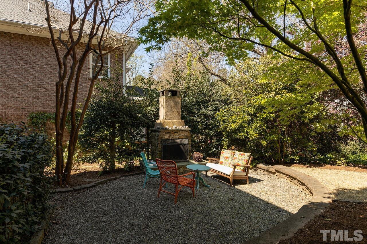 1124 Hobson Court Raleigh, NC 27607 - Photo 4 of 36 a backyard of a house with table and chairs