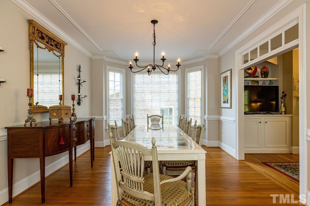1124 Hobson Court Raleigh, NC 27607 - Photo 9 of 36 a view of a dining room with furniture window and wooden floor