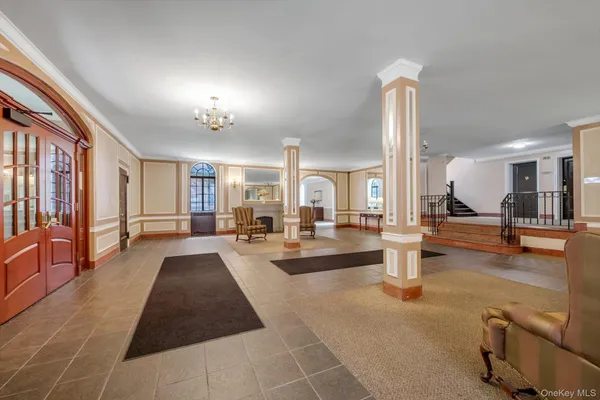 a living room with fireplace furniture and a table
