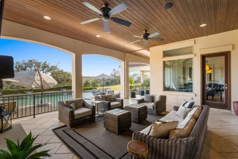 a view of a swimming pool with a patio