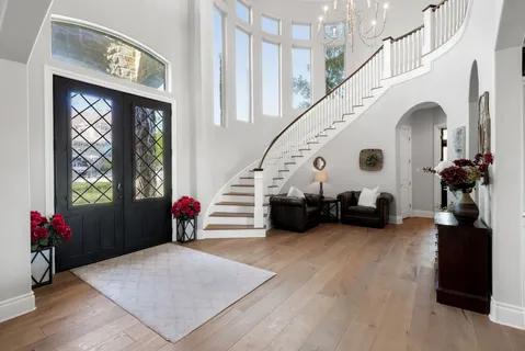 a view of a dining room with furniture window and wooden floor