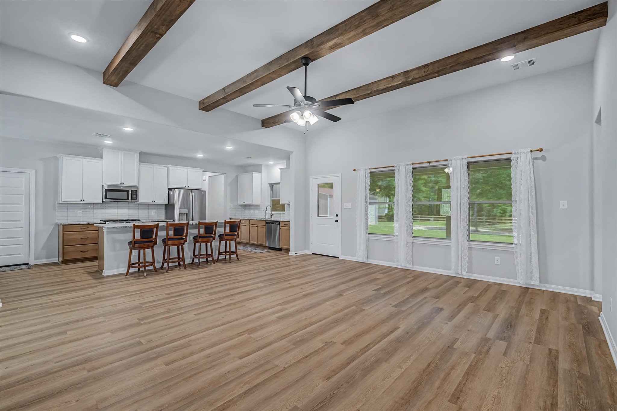 347 Iron Horse Road Willis, TX 77378 - Photo 11 of 49 Living room looking into kitchen