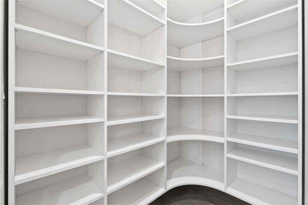 3528 North Bogan Road Buford, GA 30519 - Photo 15 of 79 a view of walk in closet with empty racks
