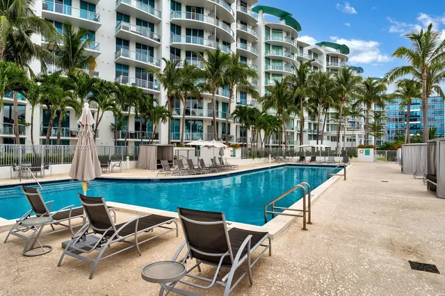 a view of a swimming pool with chairs