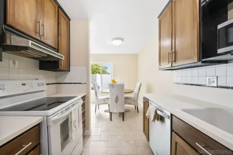 a kitchen with a sink cabinets and appliances
