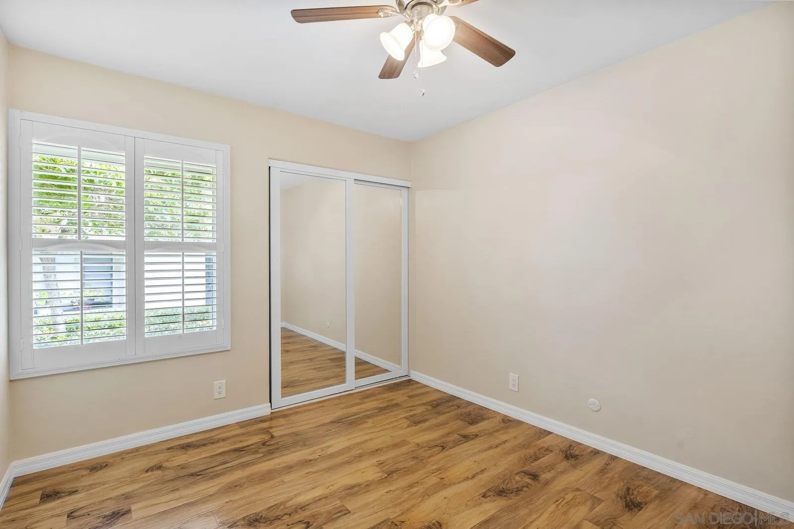 1246 Evergreen Drive Cardiff, CA 92007 - Photo 16 of 23 a view of an empty room with wooden floor and a window