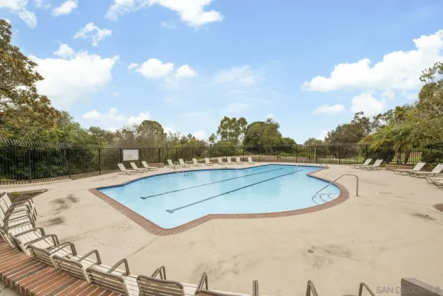 a view of a swimming pool and a yard