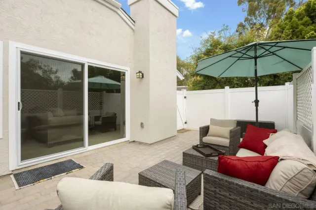 a outdoor space with patio the couch and a fire pit