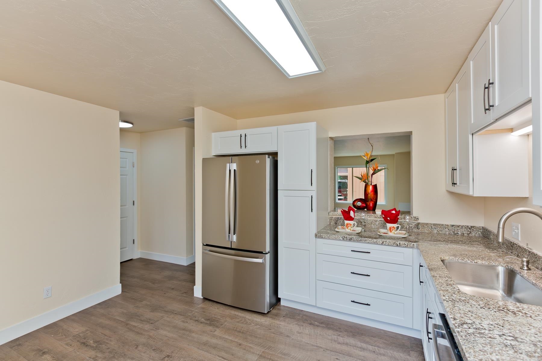 575-28 28 1/2 Road, Unit 44 Grand Junction, CO 81501 - Photo 7 of 39 a kitchen with refrigerator a microwave and cabinets