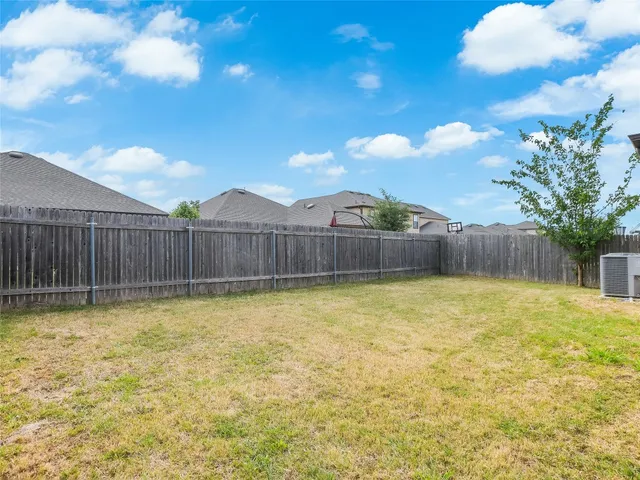 a view of a swimming pool and outdoor seating
