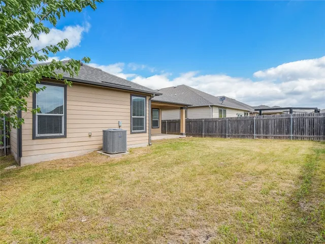 a house view with swimming pool in front of it