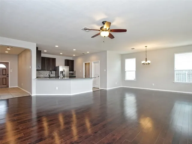 a view of a kitchen with a sink and a window