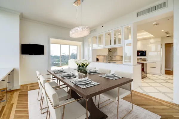 a view of a dining room with furniture window and wooden floor
