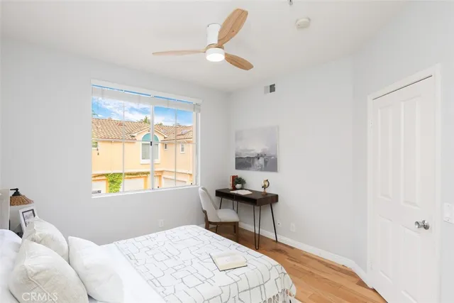 a bedroom with a bed and a table in it